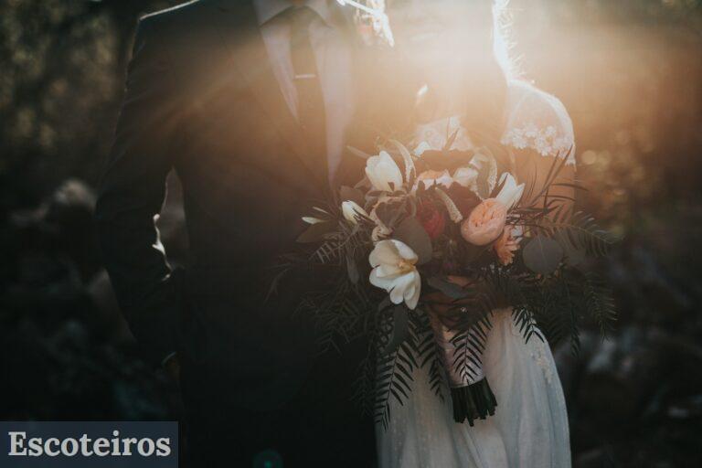 groom beside bride holding bouquet flowers